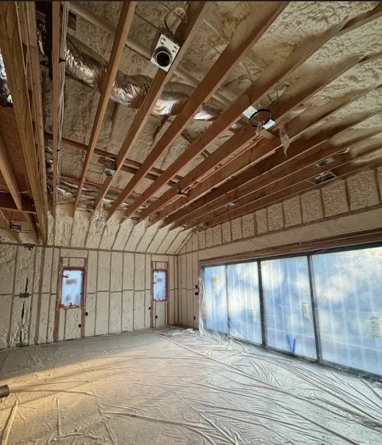 Interior walls and ceiling insulated with spray foam during new construction in Belleville